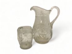 A large cut glass water jug together with a 19th century etched glass tankard
