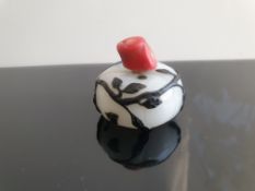 An Early Made Chinese Carved White Glass Overlay Pumpkin Snuff Bottle With Coral Stopper