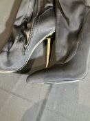 Ego Gleam On Boots Worn By A Body Double