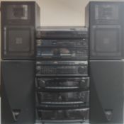 A Vintage Kenwood Stereo System With Speakers.