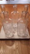 3 boxes of glass bottles with LOVE in white lettering.