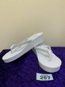 Selection of white toe post shoes