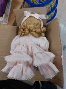 Vintage doll in pink dress