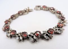 Sterling Silver Bracelet Set With 39 Garnet & Topaz Gemstones