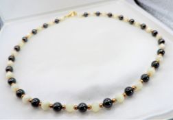 17 inch Hematite White Jade Gold Bead Necklace