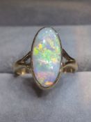 A Stunning 9ct Gold and 2ct Opal Ring. Appears To Have The Full Spectrum of Colours.
