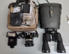 A Collection of Vintage Camera Equipment To Include An Olympus OM-40, Miranda Binoculars and A Ni...