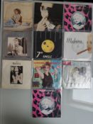 A Collection of 40 X 7” Singles. To Include 10 X Madonna – 10 X Reggae - Rock – 10 X Triangle Cen...