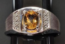 A 10ct White Gold and Citrine Ring. Size T ½.