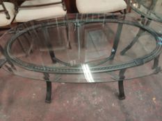 An Oval Coffee Table. Heavy Bronze Style Metal Frame.