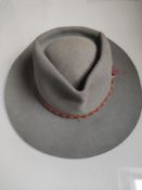 An Akubra Down Under Australian Hat With Band and Feather