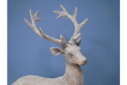 Large Snowy Stag Balancing on Ball Ornament