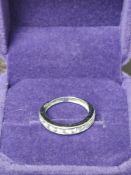 9Ct White Gold Ring With White Stones.