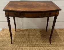A Regency style mahogany side table on tapering out swept legs (H74cm W82cm D47cm)