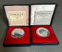 Two 1998 silver coins commemorating the Titanic by the International Currency Bureau.