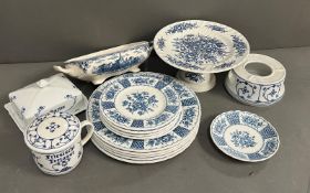 A selection of blue and white china to include cake stand, plates, butter dish etc. Various makers