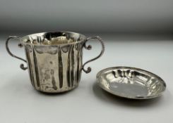 A silver lidded sugar bowl marked to base Carrington & Co 130 Regent Street, hallmarked London 1892,