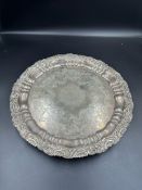 A silver tray on three feet, hallmarked for Sheffield 1909 by Joseph Rodgers & Sons