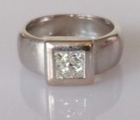 A diamond ring, set with four princess-cut diamonds, weighing an estimated total of 0.40 carats