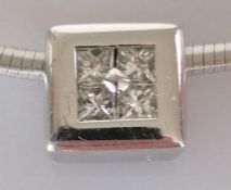 A diamond pendant, set with four princess-cut diamonds, weighing an estimated total of 0.35 carats