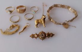 A Victorian Etruscan-style gold memorial brooch with seed pearl and ruby decoration