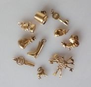 An assortment of 9ct gold charms, hallmarked, 18g