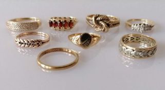 An assortment of eight 9ct gold rings, some gem-set, various sizes/dates, all hallmarked, 22g