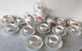 A Meissen hand painted 'Rose Moss' pattern coffee pot, jug and sugar bowl