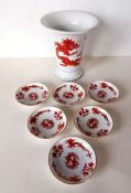 A Meissen hand-painted trumpet vase with red dragon chasing a pearl design