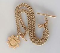 A gold Albert chain with graduated flat curb-links, T-bar and single clasp with 9ct gold medal
