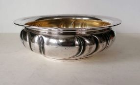 A circular 800 silver basin with gilt interior on a flat base, 8 cm H x 24 diameter, 479g