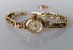 A mid century Tissot ladies manual wristwatch with a 9ct yellow gold case and bracelet, hallmarked,