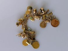 A 9ct yellow gold charm bracelet to include an Edwardian gold sovereign, 1904; George III sovereign