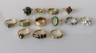 Three gem-set rings in 18ct yellow gold settings, all size J, 8.9g; one wedding band