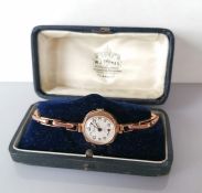 An early 20th century Precista ladies dress watch in a hallmarked 9ct gold case and strap