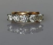  A five-stone diamond ring on a yellow gold claw setting, each diamond approximately 0.50 carats