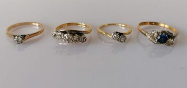 Four mid-20th century 18ct yellow gold and platinum rings