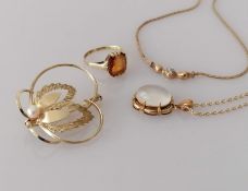 A yellow gold brooch with fern leaf and pearl decoration, 3.5 cm; a citrine gold ring, size K