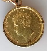 A George IV shield back gold sovereign, 1829, in a 9ct gold mount and serpentine necklace, 42 cm