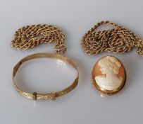 Two yellow gold rope twist chains, 37, 44 cm; a child's bangle with etched decoration, 14g