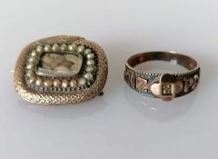 A Victorian gold mourning brooch with serpent surround and seed pearl decoration, unmarked
