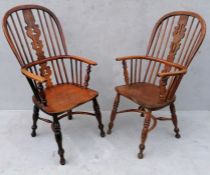 A near pair of 19th century ash and elm high-back Windsor chairs with carved splats