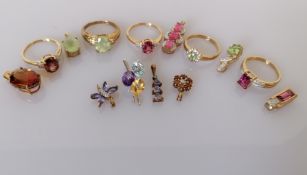 Five gem-set gold pendants with matching rings, mostly size O, P, and four other pendants
