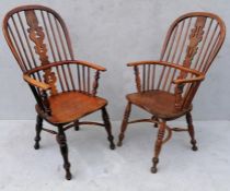 A near pair of 19th century ash and elm high-back Windsor chairs with carved splats