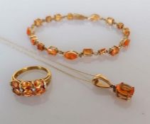 An orange cubic zirconia tennis or line bracelet, 18cm, with matching ring, size O, and pendant chai