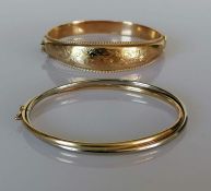 A 9ct yellow gold hinged bangle with etched floral decoration of tapering form, and another