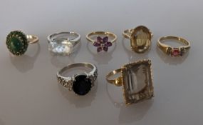 An sapphire and diamond ring on an 18ct white gold claw setting, the oval sapphire 11 x 8mm