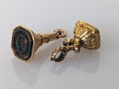 Two 19th century yellow metal fob seals with bloodstones, one inscribed 'Praetio Prudentia Praestat'