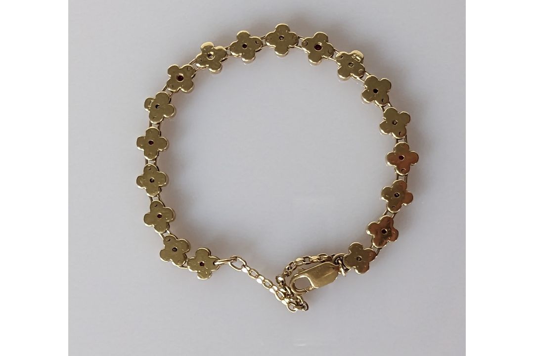 A 9ct gold bracelet with diamond and garnet floral design, hallmarked, 15.5 cm, 20g - Image 3 of 3