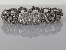 An Art Deco diamond and platinum cocktail watch bracelet, the Lusina Geneve Swiss timepiece signed